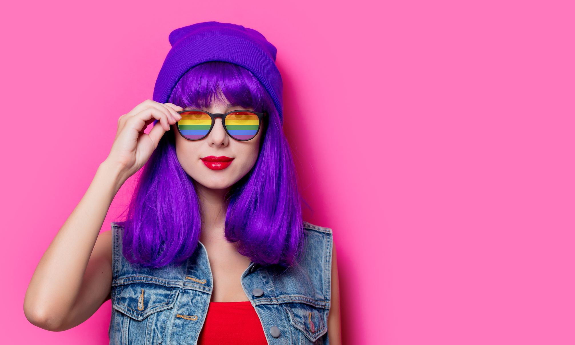 Girl with purple hair and with rainbow eyeglasses